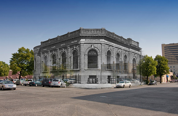 Exterior of the brick library building. The building is designed with arched windows and the names of prominent authors on the frieze. Names visible on the frieze include Homer, Plato, Dante, Milton,